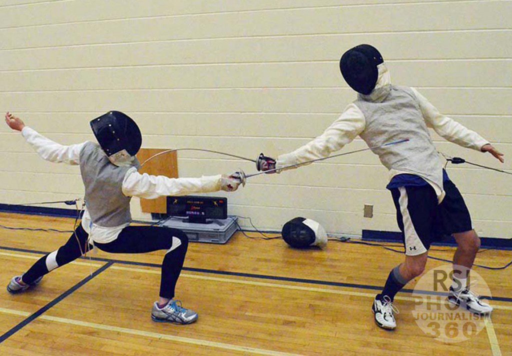 Ryerson Rams fencing team members practicing sparing on October 2nd in the Lower Kerr Hall Gym in Toronto, Oct. 2.2015. 