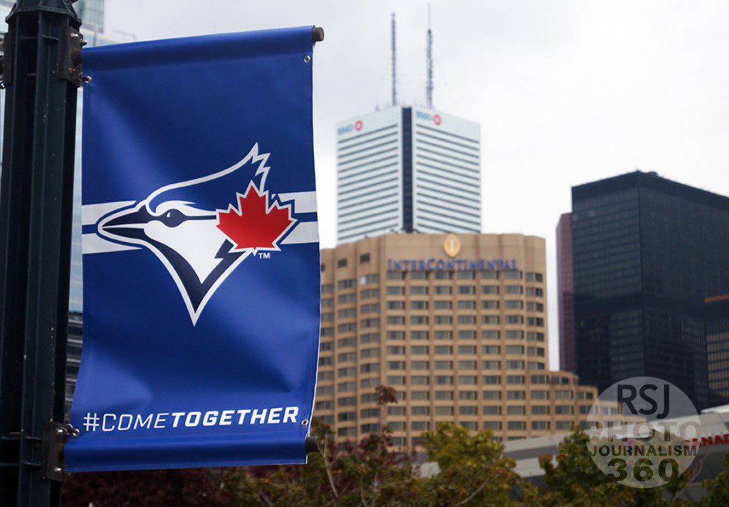 A “#COMETOGETHER” sign outside of the Rogers Centre overlooks the city on the morning of Oct. 5, 2015 as the Blue Jays get ready to open the playoffs at home against the Texas Rangers.