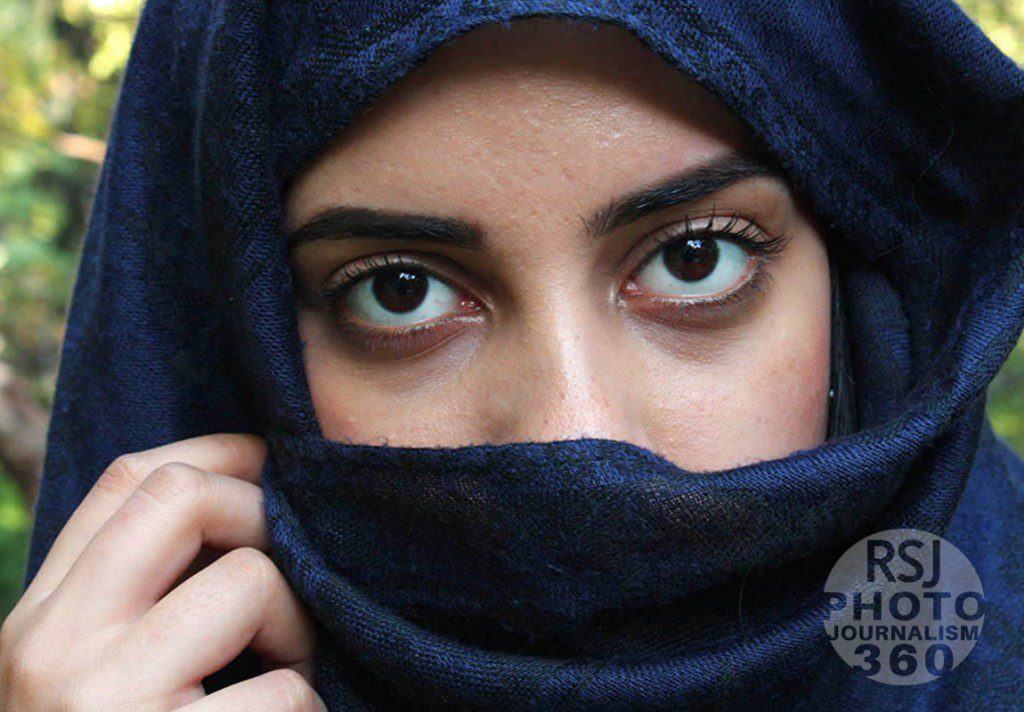 Mahyn Qureshi holds a scarf in front of her face at the Ryerson University campus in Toronto on September 23, 2015. She is posing for this class assignment.  Photo by Kanwal Rafiq