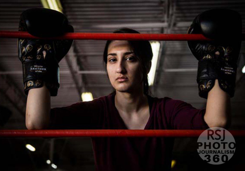 Fasiha posing between the ropes giving  a little bit of attitude at her gym, Evolution MAFA. She has been participating in martial arts for two years now, and there is a noticeable increase in confidence in her character.  Photo by Mansoor Tanweer